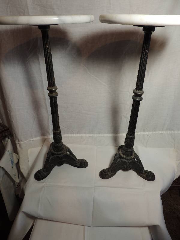 lot 282 image: Tables with metal base and white marble top. 24 H 11 34 diameter quantity of 2