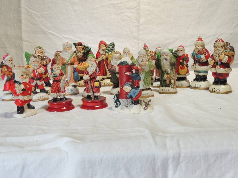 lot 424 image: Santa through the Years  dates quantity 20 4 tall made in china and Korea