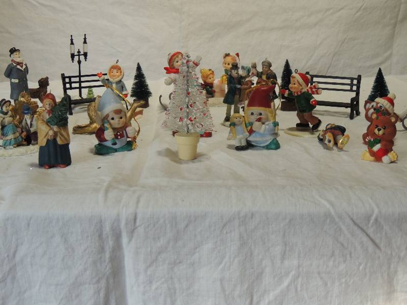 lot 426 image: Various village pieces- trees, sledding, bench, street lights approx. 3 tall