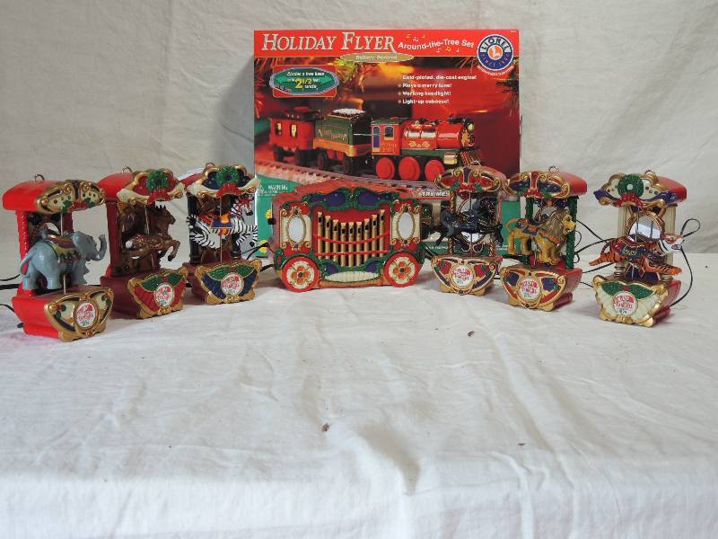 lot 430 image: Holiday Flight Battery operated around the tree set      Holiday carousel- controller  with 6 animals (could not be set up  - no carousel).