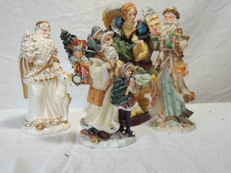 lot 432 image: 3 Santas 11 tall,  Angel on wood base 8x8x11