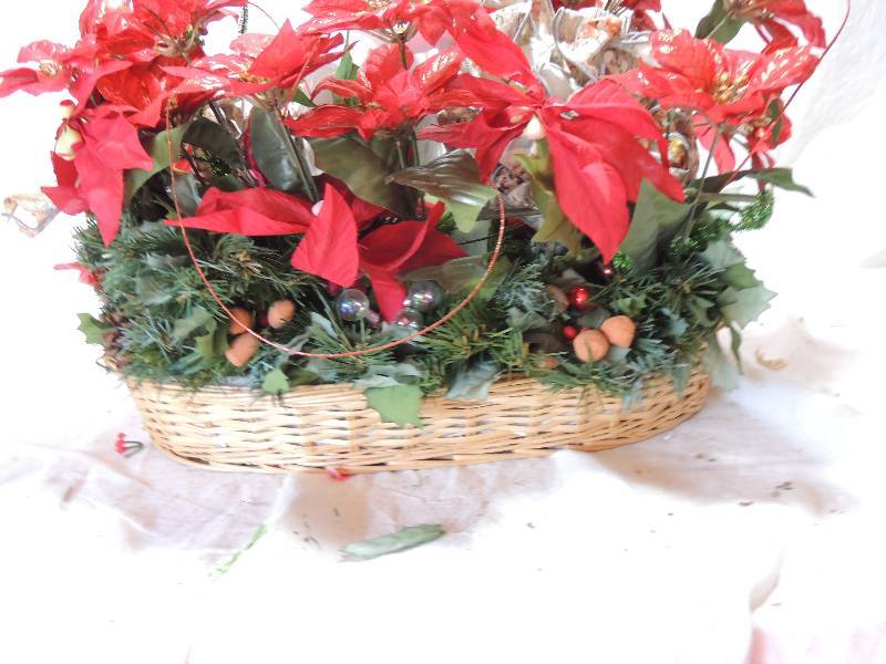 lot 451 image: Centerpiece- Candle chimney Foil Poinsettia bows in basket 15H 18 L 12wide