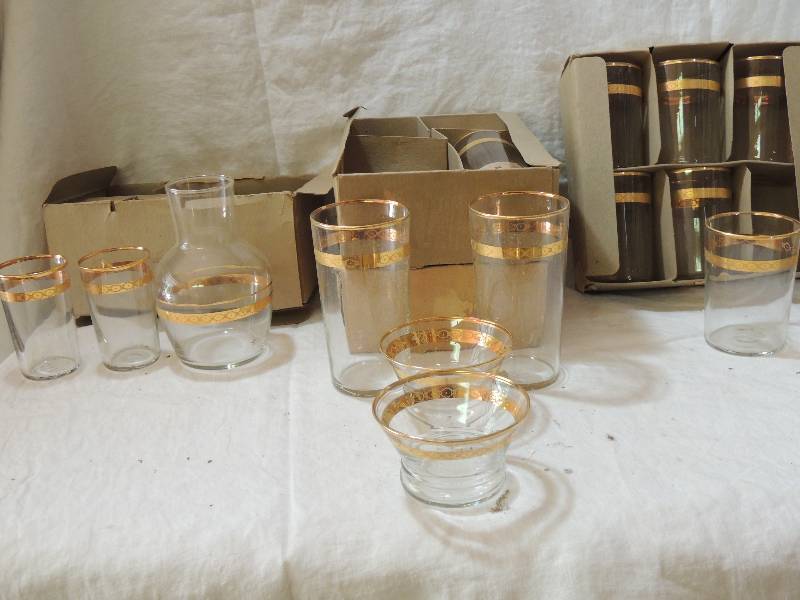 lot 478 image: Libbey Glassware Victoria pattern (1950s in original boxes)- Box K one carafe and glass, 3 fruit juice glasses,   Box P (x2)  2 ice teas and 2 sherbets and box H 6 water glasses