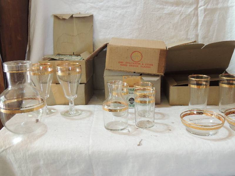lot 480 image: Libbey Glassware Victorian pattern (1950s  in original boxes) Box Q 2 beverage glasses 2 berry bowls and 1 stirrer,  Box I 1 utilicanter 3 bridge glasses each box x 2, Box R 2 goblets box with 2 boxes