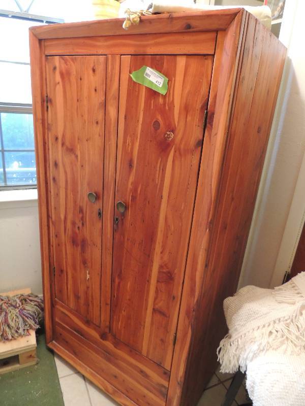 lot 412 image: Oak Armoire  Wardrobe. Cedar lined Very deep for the longest of coats. Plenty of room on the bottom to store winter blankets safely   60H X 30w X 20d