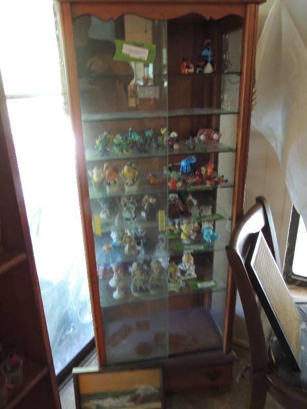 lot 363 image: Curio Cabinet 55 x 20 x 127 glass shelves and  sliding glass front 1 drawer does not include contents