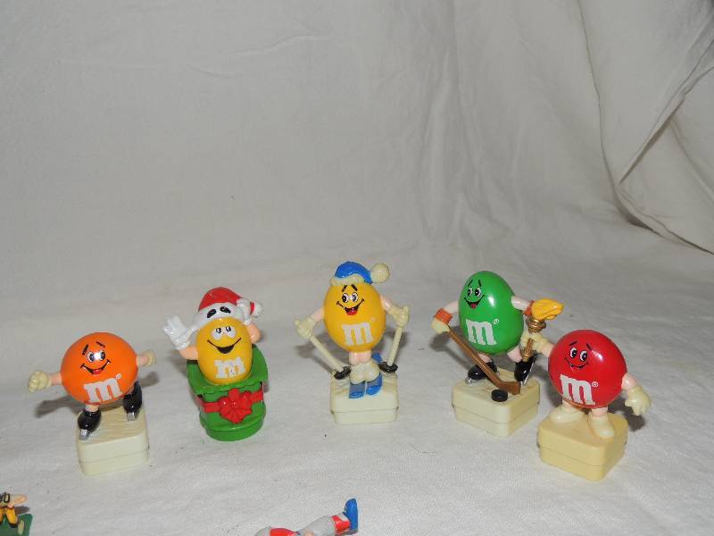 lot 366 image: M&M toys Christmas topper Hockey, Olympic FLAME  3    Ronald McDonald,   Cabbage Patch 2 12    elephant toy and more