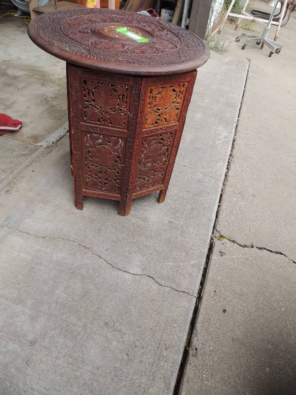 lot 501 image: Carved teak table round with inlay,  base 8 side carved Ht. 25 quantity 2
