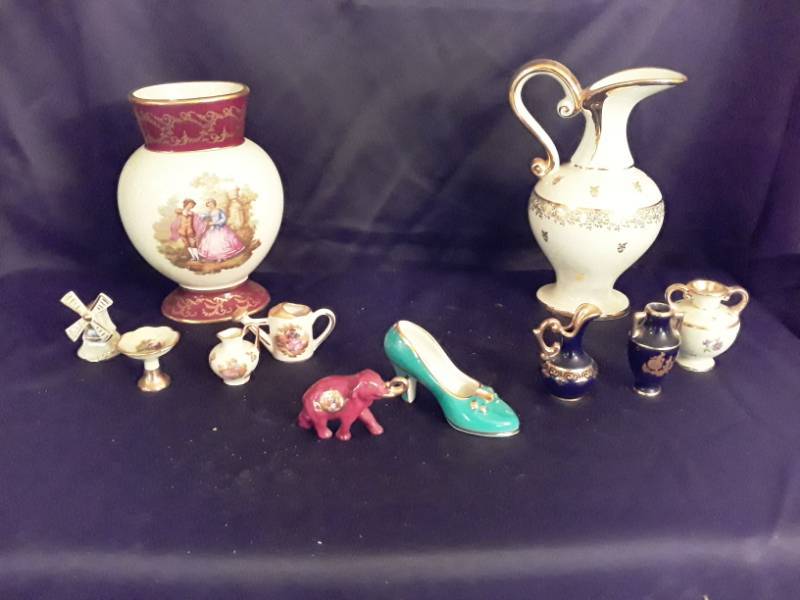 lot 101 image: Limoges- Large pitcher, small pitcher, vase, porcelain shoe, and miniature vase  water can and pink elephant