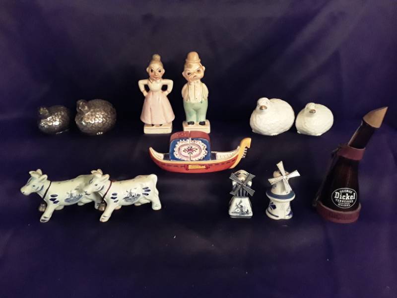 lot 92 image: Salt and pepper shakers- Doves made in England, Dutch windmills, Dutch cows ( no stoppers) HappyMade male and female, set in Japanese boat Occupied Japan and doves made out of metal