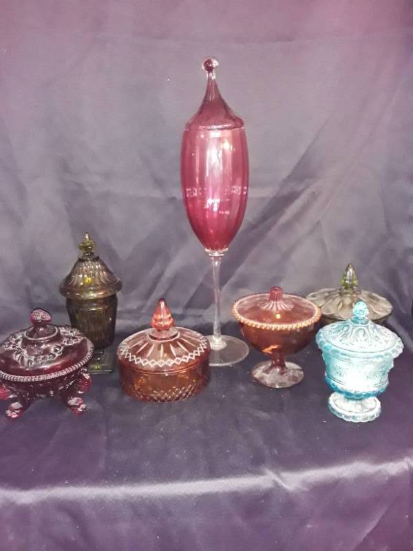 lot 93 image: Color Glass ware- Compote , Covered candy dishes red, gold x 2, blue, green and a tall red vase