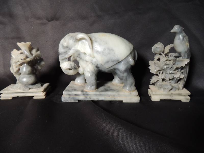 lot 672 image: ELEPHANT -MARBLE 5 X6 12 X3 12,       SOAPSTONE FLOWER CARVING - 4 X4 X 2 & SOAPSTONE BIRD CARVING - 5 X3X 1 12