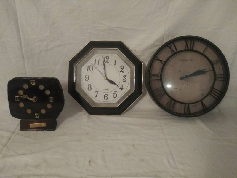 lot 404 image: 3 Clocks. -  1 Octagonal, 1 round  12 x 12,  one has black clock face mounted on Original Panama Railroad Tie (With placard) 7x7
