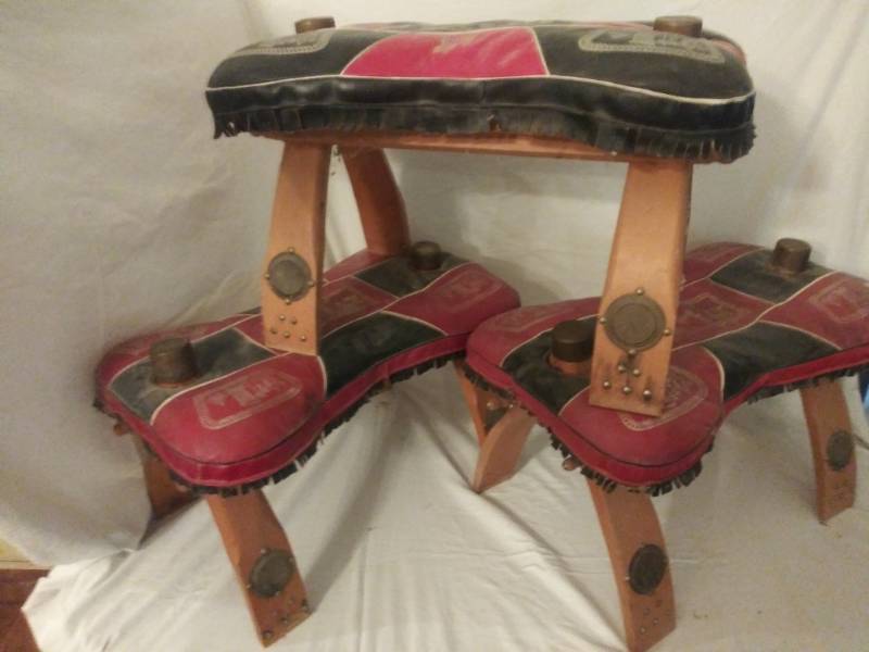 lot 399 image: Turkish Camel saddles ( not to be used on Texas Camels)  They have medallions and horn caps Great condition ( 3 total)