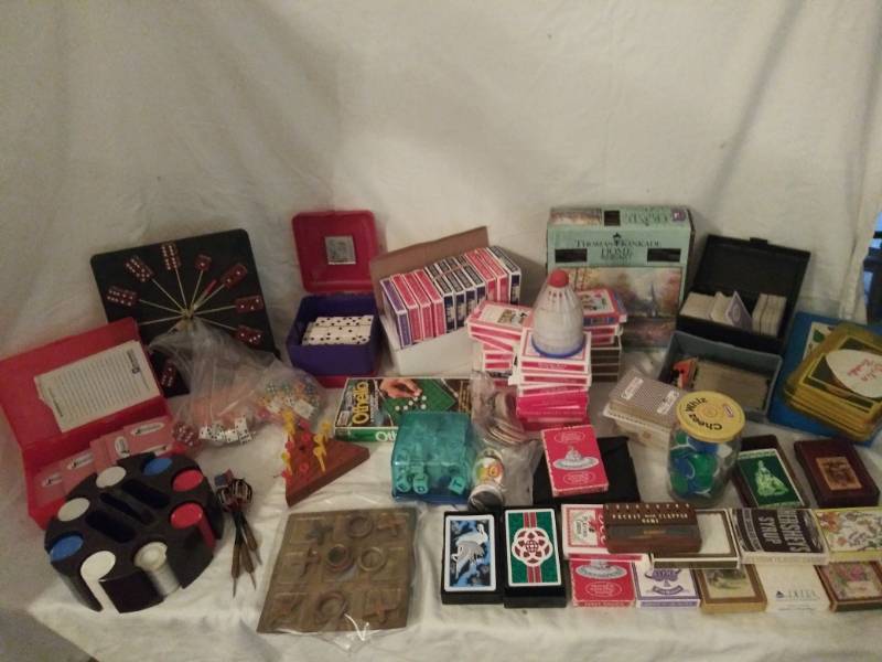 lot 383 image: Games- Decks of cards (20 plus) dice, Poker chips, Brass Tic-Tac-Toe and dice themed wall clock