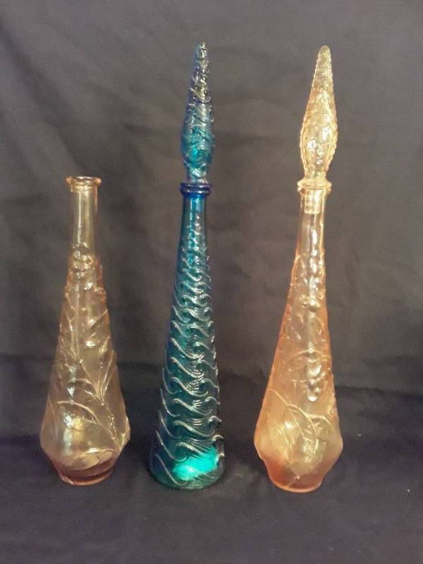 lot 8 image: 3 Bottles- two are pink one with lid 22 and one blue with lid 22