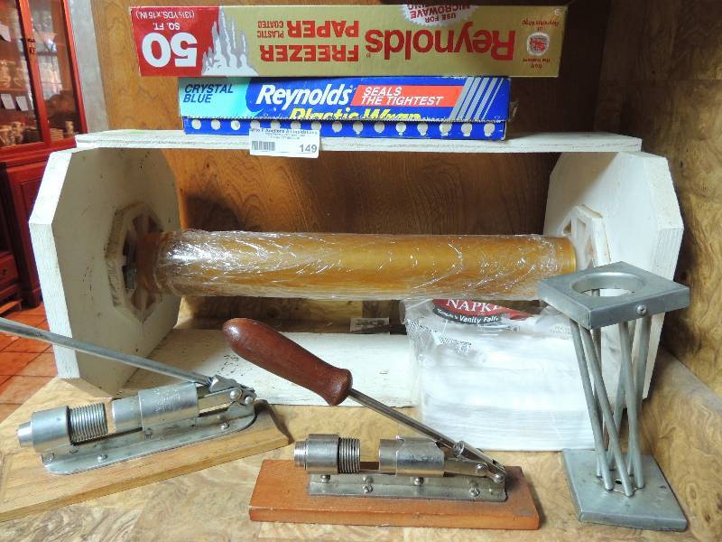 lot 149 image: 3 nut crackers for Texas Pecans and a plastic  foil wrap dispenser