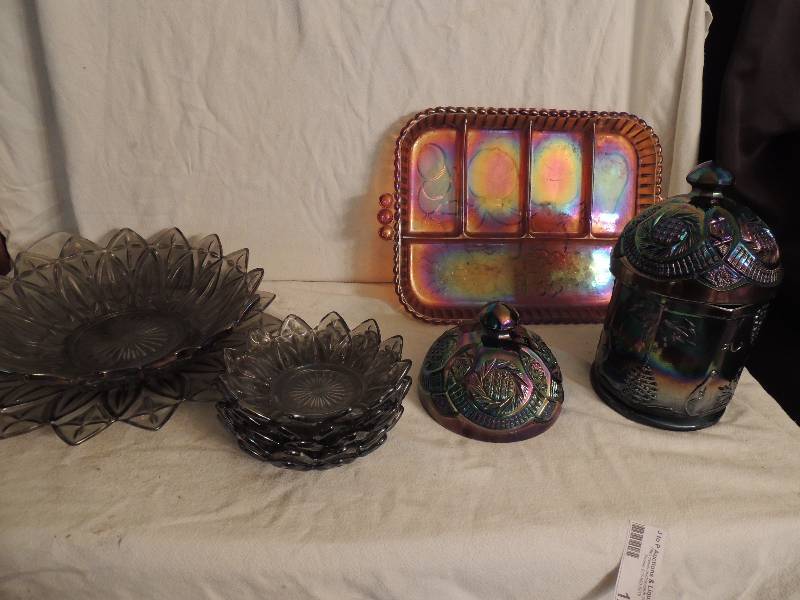 lot 126 image: Carnival Glass lot- 1 orange divided serving dish 13 x 9, 2 lids 5 diameter, one candy dish 5 tall 4 12 diameter plus a sunflower platter 11 12 diameter, 10 Bowl and five 5 12 bowls