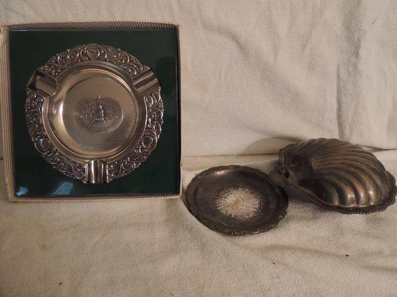 lot 129 image: Silver-plate English Caviar set with glass insert (chipped),  small trinket dish 4 made in Italy,  1972 Daughter of Eve golden apple ashtray in box 6