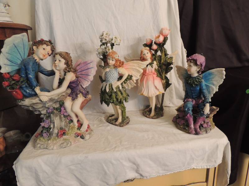 lot 24 image: 4 Fairies- 1 male blue and purple 13, 1 female pink roses 18 1 female daisy 18 and 1 male and female blue purple 18
