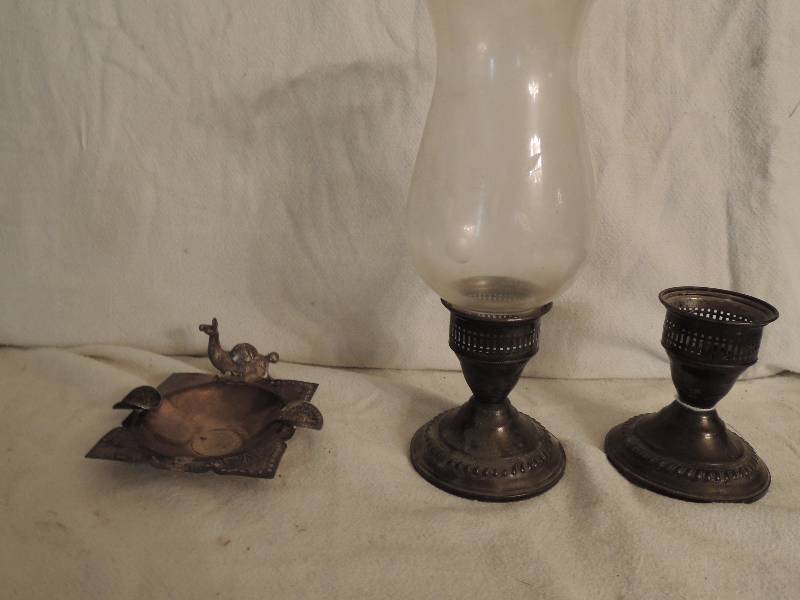 lot 26 image: Sterling Silver Candle Sticks one with chimney 3 14 Tall,  Silver ashtray with Camel Lima Peru coins attached