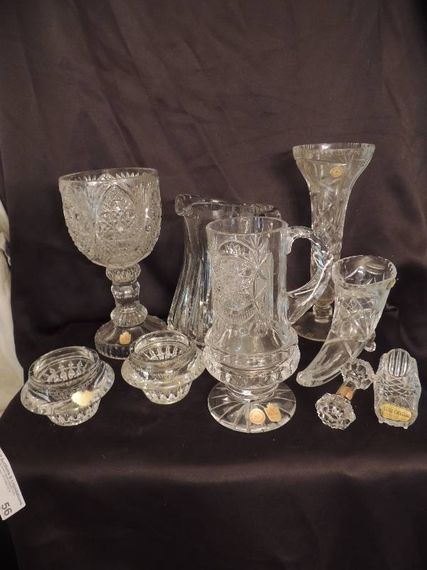 lot 56 image: Nachtmann Bleikristall 24% Bavarian Crystal- Two 9 pitchers one short one tall and 10 vase   . West German made candle sticks 2  12 tall 4  wide,  vase 10 12 , spoon rest, Horn o plenty 8  12 and knife rest