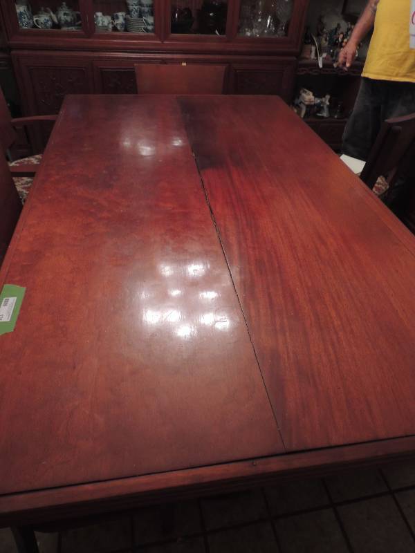 lot 135 image: Mahogany dining table double pedestal base 72  length 42 wide.is matching chairs above