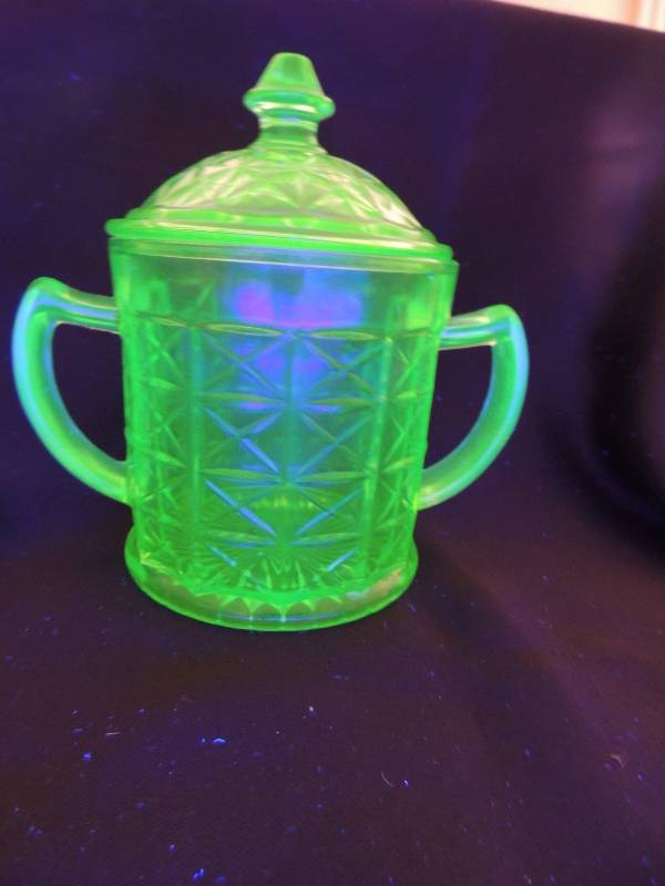 lot 69 image: URANIUM OXIDE GLASS 2 handles cup with lid 6 high