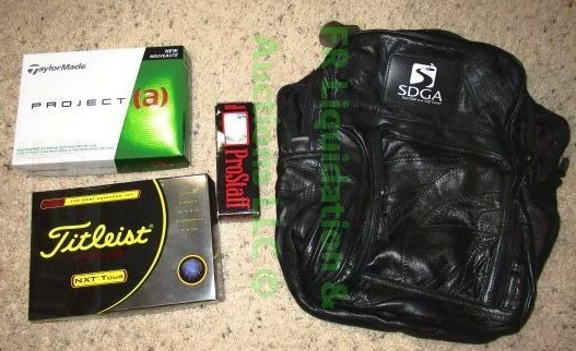 lot 150 image: Titleist & Taylormade unused golf balls plus a SDGA leather golf ball bag