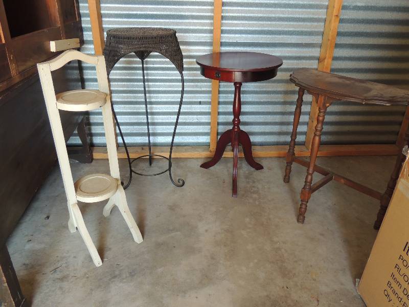 lot 699 image: Round metal wicker top table 30 tall 14 diameter. White plant table 2 holder wooden 30 tall 8  12 wide 10  12 deep. Wooden round end table with small drawer 25  tall 16 diameter. Brown wooden wall table 2 tall 22 wide 10  34 depth 12 table