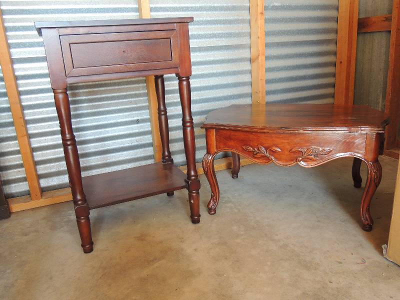 lot 700 image: Brown wooden bedside table . Broken knob on drawer. 30 tall 19wide 15 depth.   Short side table carved wood  15 12 tall 28 long 20 depth