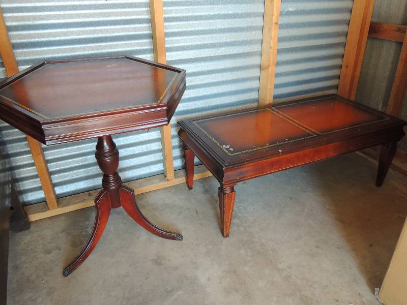 lot 701 image: 2  Mid Modern matching tables. With Leather tops - -  1 end table octagon shape 27  22 tall 22  14 depth 25  34 wide.   1 coffee table 15  34 tall 40 long 20 depth