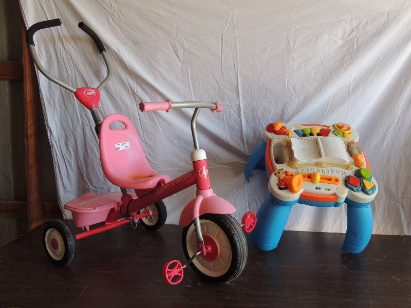 lot 710 image: Baby learning table with ABCs 123s.   Radio flyer toddler bike with handlebars for momdad to push
