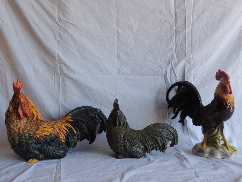 lot 727 image: Wooden rooster made in China 13 tall,  Resin Bronze TINT Rooster 9  34 tall,    Artesian Spirit Ceramic Rooster made in Mexico 14  12 tall