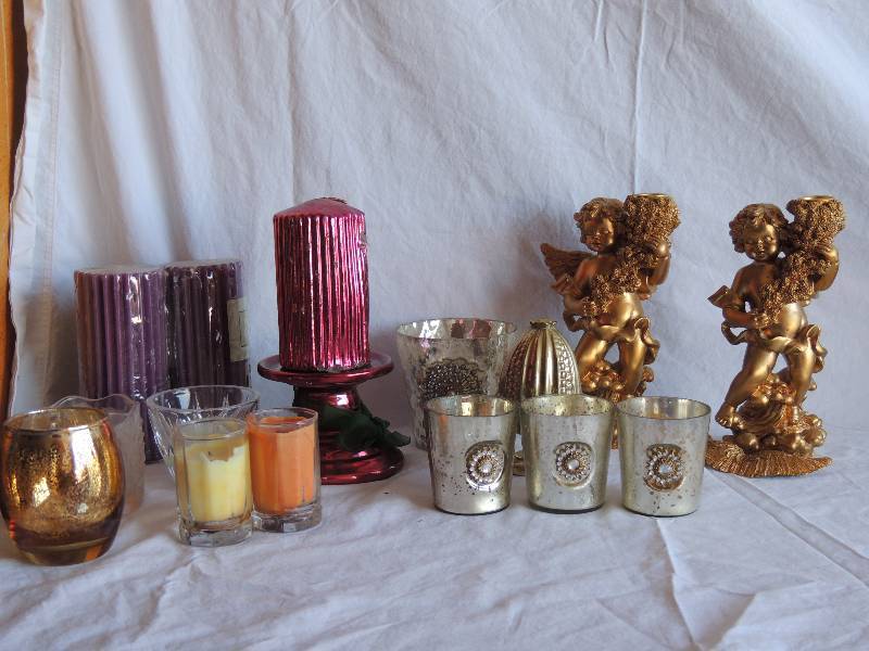 lot 731 image: 2 Cherub candleholder ( 1 has broken wing) 8 tall. Assorted lot of candles