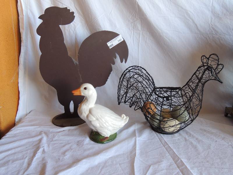 lot 741 image: Metal rooster yard art 17  12 tall 14 wide , small ceramic duck made in redwood city and rooster basket with 5 faux eggs because roosters don�t lay eggs (duh)