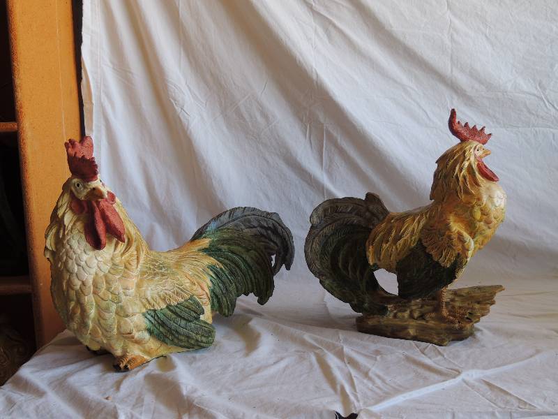 lot 747 image: 2 Hollow wooden roosters. One on stand is 13 12 tall. One on wood piece is 14  12 tall