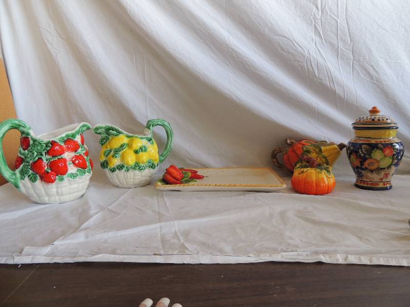 lot 773 image: Porcelain pictures 1 with strawberries 1 with lemons. Both have handles. Decorative fruit canister, fall dcor picture with small pumpkin, red pepper porcelain platter