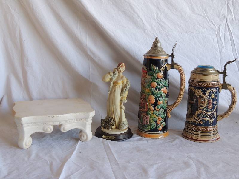 lot 779 image: White heavy stand small  Roberto Brombilla  statue - Lad with Dog  2 steins  made in Western Germany