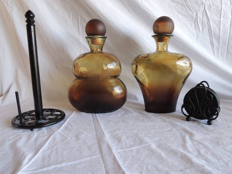 lot 782 image: 2 large blown glass decanter with corks -13,   black coasters and paper towel holders