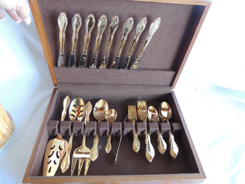 lot 789 image: Brown silverware case with International EP Korea silverware set  Service for 8 (40 pcs) & 7 serving pieces    1 knife block with kitchen accessories Misc. kitchen silverware