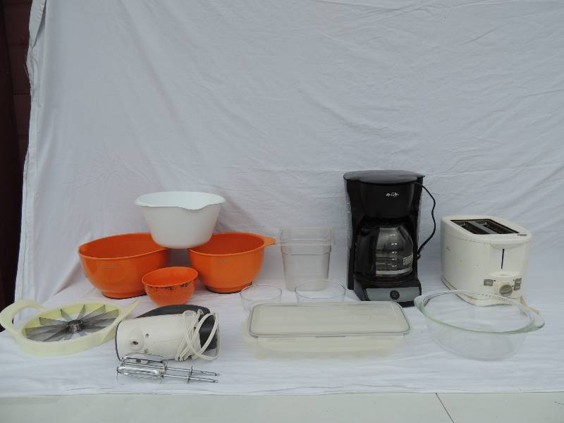 lot 801 image: Sunbeam mix master mixer, Mr. Coffee maker ( 12 cups), Sunbeam gold toaster plus bagel and pastries,  2 kitchen aid orange mixing bowls,  Rubbermaid fridge egg holder   1.5 qt. glass bowl and melon slicer