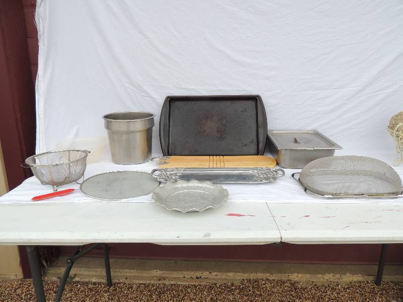 lot 802 image: Decorative serving platter, silver serving tray with handles, large black baking sheet    food pan with lid for steam table, plastic strainer , 3 wire pan carriers