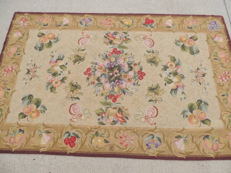 lot 814 image: Micro hook floor rug with fruit design 95  Long 60 wide and Morcella needle point rug Oak platinum 6 by 9