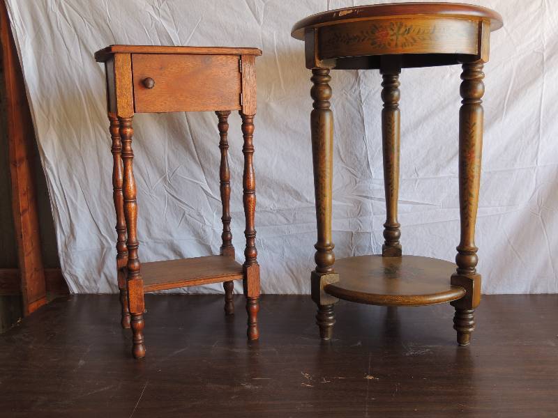 lot 704 image: Wooden table. Small hole in top- door on front. 25  34tall 14 wide 10 deep.10262019    Tall Oval side tableStand with Rose design, has a shelf at bottom 27  12 tall 14 diameter ( has some wear)