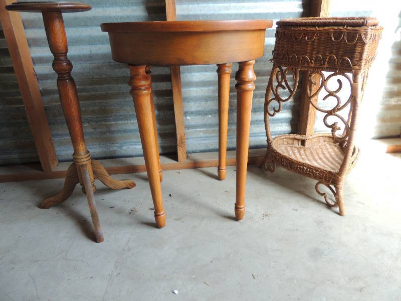 lot 686 image: Heart shaped wicker table. Top opens 25 14  tall,  Wood round table with flower dcor inlay 25 .5 tall    small circle brown plant stand 9 diameter 27.25 tall