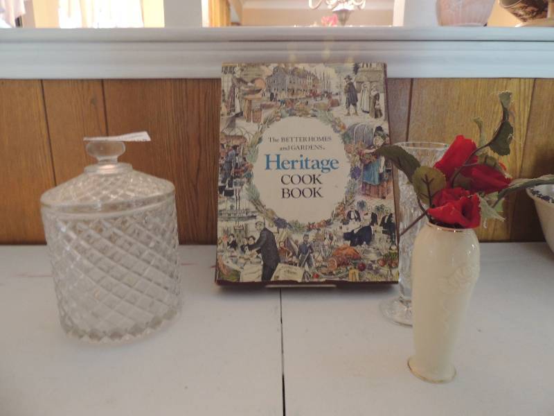 lot 955 image: PRESSED GLASS COVERED CANDY DISH,      CREAM COLORED LENOX VASE 6 CLEAR BUD VASE, HERITAGE COOKBOOK