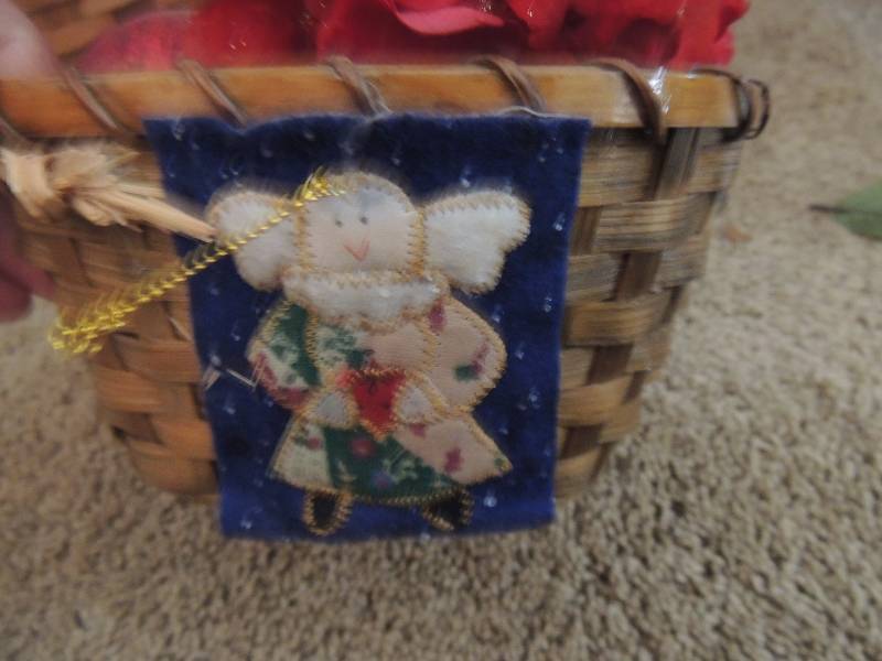 lot 978 image: Silk rose arrangement in light basket