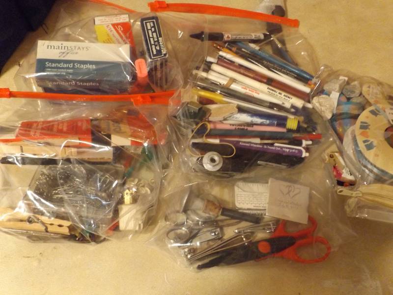 lot 916 image: OFFICE SUPPLIES -SEVERAL BAGS - STAPLERS, PENS, SISSORS, STAPLES    PLUS