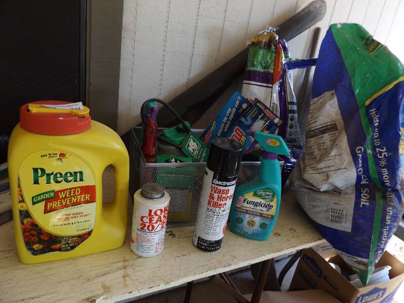 lot 932 image: Used bags of Dollar weed killer, garden safe fungicide and miracle grow, DRANO